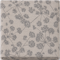 A folded textile item, likely a blanket or throw, featuring a gray dandelion-like botanical pattern on a textured beige background.