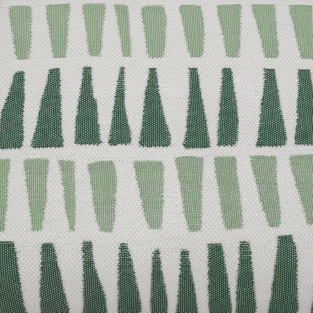 A close-up of woven fabric with a repeating geometric pattern of vertical and triangular shapes in light and dark green on an off-white background.